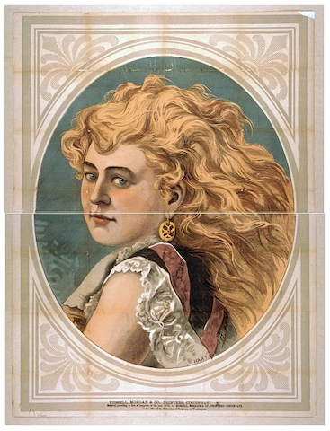woman with voluminous hair looking over her shoulder