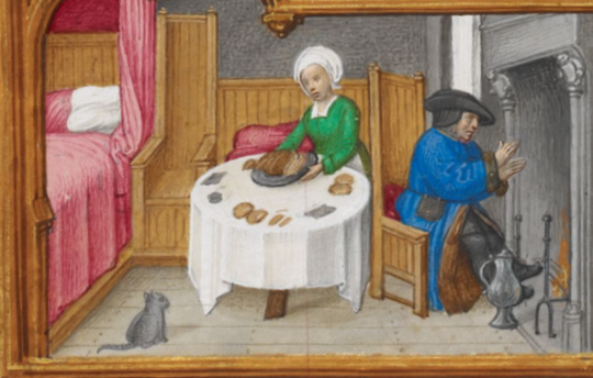 couple by fire, man warming feet, woman serving food